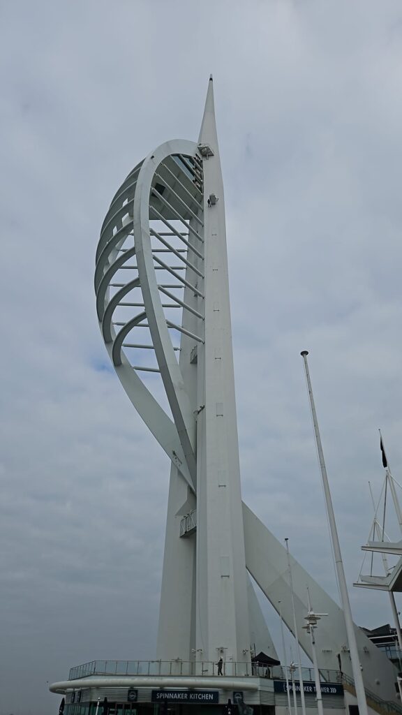Spinnaker tower with someone abseiling down the side