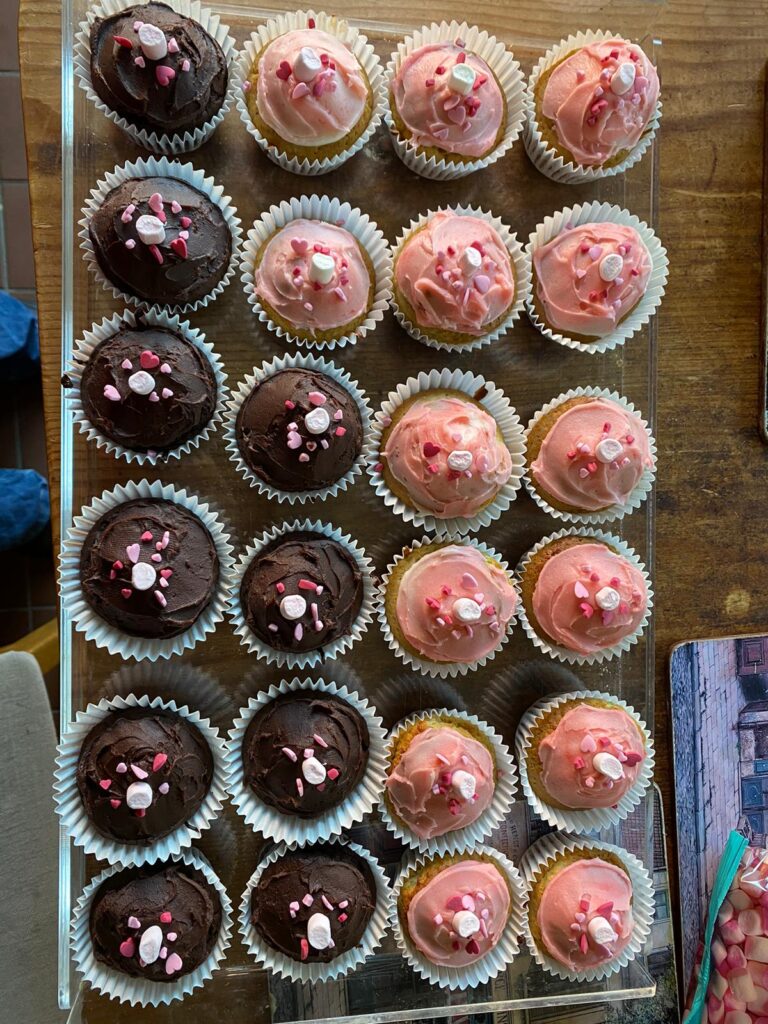 Cupcakes with brown and pink icing and marshmallows in the middle to look like boobs.